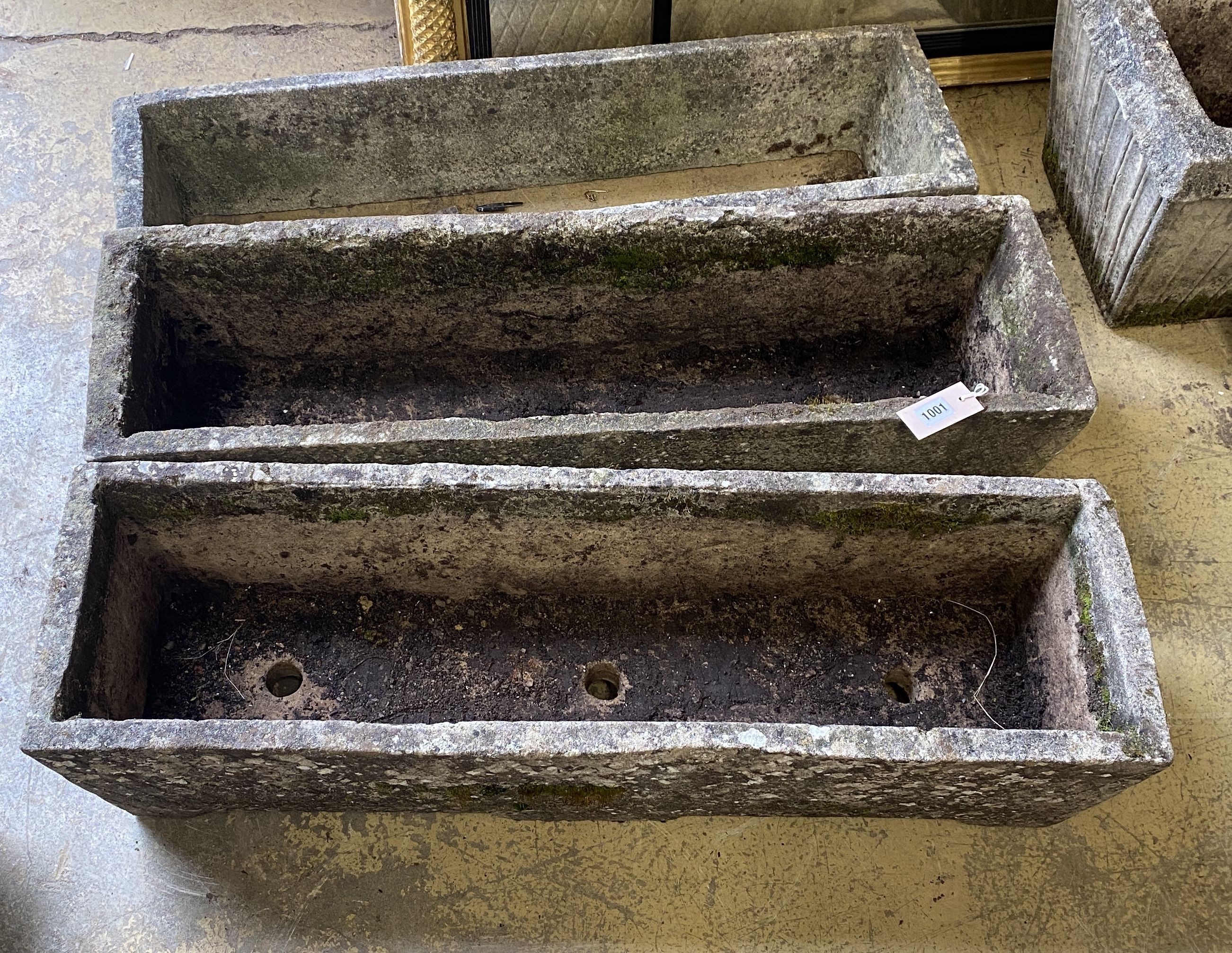 Three rectangular reconstituted stone garden planters, one lacking base, largest width 91cm, height 26cm